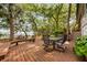Outdoor deck area with seating, offering a scenic view of the water and lush greenery at 2970 Roseville Rd, Wadmalaw Island, SC 29487