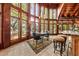 Bright dining area featuring a chandelier and floor to ceiling windows with views at 2970 Roseville Rd, Wadmalaw Island, SC 29487