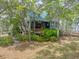Charming two-story home with lush landscaping and a welcoming front porch at 2970 Roseville Rd, Wadmalaw Island, SC 29487