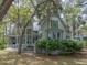 Beautiful home with a porch and surrounded by lush trees at 2970 Roseville Rd, Wadmalaw Island, SC 29487