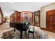 Grand foyer featuring spiral staircase, piano, seating area and abundant natural light creating a bright and inviting space at 2970 Roseville Rd, Wadmalaw Island, SC 29487