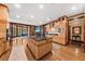 Spacious kitchen features a large island, custom cabinets, stainless steel appliances, stone fireplace, and an adjacent breakfast nook at 2970 Roseville Rd, Wadmalaw Island, SC 29487