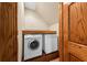 The laundry room includes wooden door trim, a front-load washer, and a dryer at 2970 Roseville Rd, Wadmalaw Island, SC 29487
