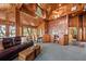 Spacious living area featuring wood paneling, an open layout, and serene views at 2970 Roseville Rd, Wadmalaw Island, SC 29487