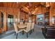Open-concept space featuring a kitchen, dining area, and inviting living room with fireplace at 2970 Roseville Rd, Wadmalaw Island, SC 29487