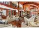 Elegant living room featuring soaring ceilings, detailed woodwork, and large windows at 2970 Roseville Rd, Wadmalaw Island, SC 29487
