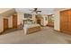 Bright main bedroom boasts neutral walls, carpet flooring, and wooden door trim at 2970 Roseville Rd, Wadmalaw Island, SC 29487