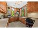 Home office with built-in cabinets, a spacious desk area, natural light and views of the surrounding landscape at 2970 Roseville Rd, Wadmalaw Island, SC 29487