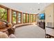 Bright sitting room with bay window and a view, comfortable seating, and entertainment center at 2970 Roseville Rd, Wadmalaw Island, SC 29487