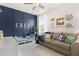 Charming bedroom features a custom accent wall, couch and toddler bed and ample lighting at 308 Watergrass St, Summerville, SC 29486