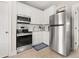 Well-lit kitchen equipped with modern appliances, white cabinets, and a sleek design at 308 Watergrass St, Summerville, SC 29486