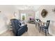 Cozy living room featuring comfortable seating, a ceiling fan, and natural light from the windows at 308 Watergrass St, Summerville, SC 29486