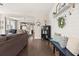 Open-concept living room showing hardwood floors and seamlessly connects to the dining area at 308 Watergrass St, Summerville, SC 29486
