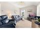 Inviting living room featuring comfortable seating, a ceiling fan, and a view from the windows at 308 Watergrass St, Summerville, SC 29486
