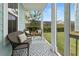 Relaxing screened-in porch with comfortable seating and a view of the backyard at 308 Watergrass St, Summerville, SC 29486