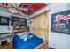 Bedroom with a sliding wood door, ceiling fan, and political banners at 312 Lake Moultrie Dr, Bonneau, SC 29431