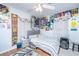 Bedroom with colorful decorations, natural light, ceiling fan, and hardwood floors at 312 Lake Moultrie Dr, Bonneau, SC 29431