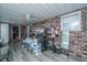 Unique bedroom featuring a bunk bed, brick wall, and neutral flooring at 312 Lake Moultrie Dr, Bonneau, SC 29431