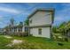 Exterior view of a two-story home with white siding and a spacious lawn at 312 Lake Moultrie Dr, Bonneau, SC 29431