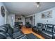 Spacious living room with hardwood floors, comfortable leather seating, and elegant decor creating a welcoming atmosphere at 312 Lake Moultrie Dr, Bonneau, SC 29431