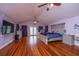 Expansive main bedroom features a vaulted ceiling, hardwood floors, and an ensuite bathroom at 312 Lake Moultrie Dr, Bonneau, SC 29431