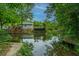 Picturesque waterfront view with a charming home and private dock at 312 Lake Moultrie Dr, Bonneau, SC 29431