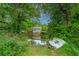 Peaceful waterfront view of a home and dock surrounded by lush greenery at 312 Lake Moultrie Dr, Bonneau, SC 29431