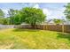 Spacious backyard featuring a manicured lawn, a wooden fence and a wooden pergola at 315 Courtney Round, Summerville, SC 29486