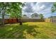 Fenced backyard with a detached shed and a mature tree on a well-manicured lawn at 315 Courtney Round, Summerville, SC 29486