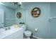 Modern bathroom showcasing a white vanity, contemporary fixtures, a large mirror, and stylish shelving at 315 Courtney Round, Summerville, SC 29486