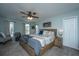This bedroom has natural light, ceiling fan, carpet and attached ensuite bathroom at 315 Courtney Round, Summerville, SC 29486