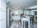 Spacious kitchen boasting white cabinets, stainless steel appliances, granite countertops, and modern lighting at 315 Courtney Round, Summerville, SC 29486