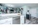 Modern kitchen with stainless steel appliances, granite countertops, white cabinets, and open to the living room at 315 Courtney Round, Summerville, SC 29486