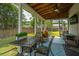 Screened porch with overhead fan featuring an outdoor furniture set and view of the backyard at 315 Courtney Round, Summerville, SC 29486