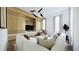 Open living room featuring modern lighting, wood paneling, built-in shelving, and a comfortable sectional sofa at 33 Duany Rd, Mount Pleasant, SC 29464