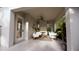 Cozy covered patio with fireplace, comfortable seating, and natural light at 33 Duany Rd, Mount Pleasant, SC 29464