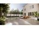 Inviting outdoor pool with lounge chairs, palm trees, and privacy fence at 33 Duany Rd, Mount Pleasant, SC 29464