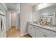 Bright bathroom with double vanity, granite countertop, modern fixtures, and a glass-enclosed shower at 333 O'Leary Circle, Summerville, SC 29483