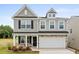 Charming two-story home with gray siding, stone accents, and a two-car garage at 333 O'Leary Circle, Summerville, SC 29483