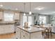 Open kitchen overlooking the living room features a granite island with seating at 333 O'Leary Circle, Summerville, SC 29483