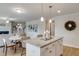 Open kitchen overlooking the living room features a granite island with seating at 333 O'Leary Circle, Summerville, SC 29483