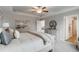 Comfortable main bedroom with tray ceiling, soft lighting, and a view to the ensuite bathroom and closet at 333 O'Leary Circle, Summerville, SC 29483