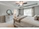 Relaxing main bedroom with tray ceiling, large window, and stylish decor, next to the ensuite bathroom at 333 O'Leary Circle, Summerville, SC 29483