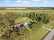 Aerial view of a charming home with large yard and wooded surroundings at 341 Sugar Hill Rd, Saint George, SC 29477