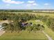 Aerial view of home with shed in wooded lot featuring expansive private yard in coastal region at 341 Sugar Hill Rd, Saint George, SC 29477
