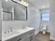Bright bathroom featuring double vanity, black hardware, and neutral paint at 341 Sugar Hill Rd, Saint George, SC 29477