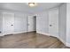 Neutral bedroom offers wood-look flooring and ample closet space with 3 separate doors at 341 Sugar Hill Rd, Saint George, SC 29477