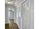 Hallway features wood floors and white closets, leading to additional rooms at 341 Sugar Hill Rd, Saint George, SC 29477