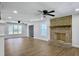 A spacious living room includes ceiling fans, recessed lighting, fireplace, and new floors at 341 Sugar Hill Rd, Saint George, SC 29477