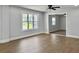 Bright living room featuring natural light, neutral paint, and new floors at 341 Sugar Hill Rd, Saint George, SC 29477